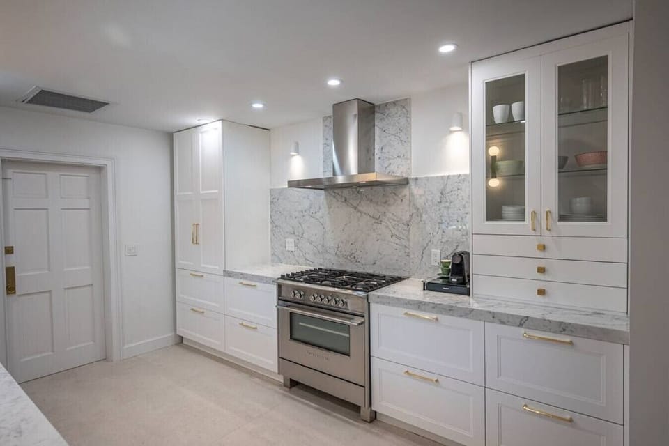 Kitchen with 36 propane range and espresso machine.