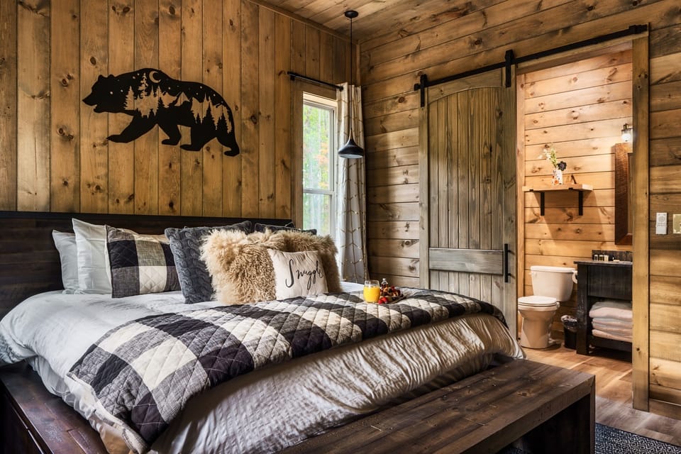 The Bear Suite is located on the main level and features a King Bed with a Waldorf Astoria II Perfect Sleeper mattress.
