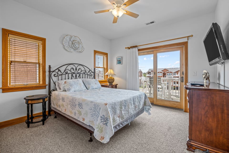 Master bedroom with nightstand, dresser and closet