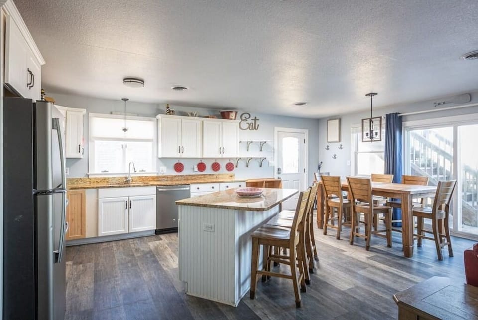 Top Level: Fully Stocked Kitchen with Island and Bar Seating