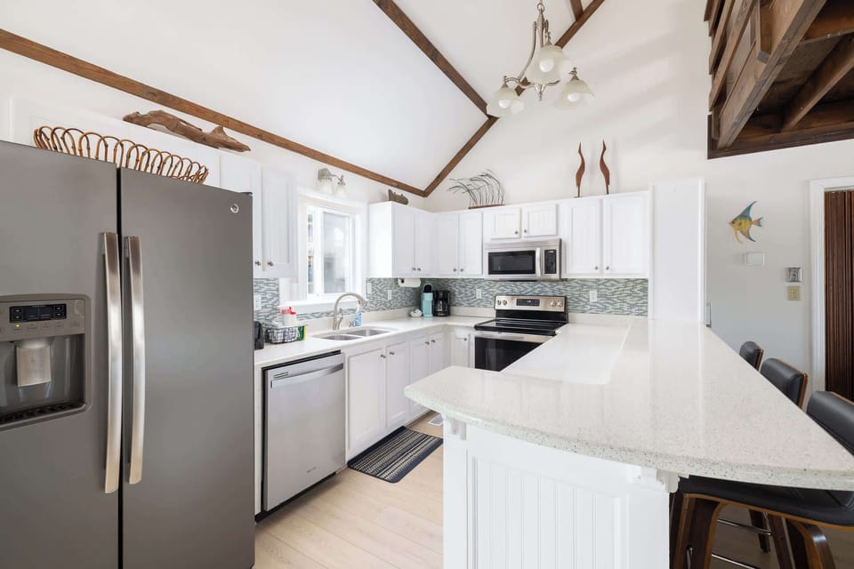 Fully Equipped Kitchen w/ Breakfast Bar Seating, Refrigerator, Dishwasher, Stove, Oven, Microwave, Toaster, Coffee Maker, Cooking Utensils and Much More