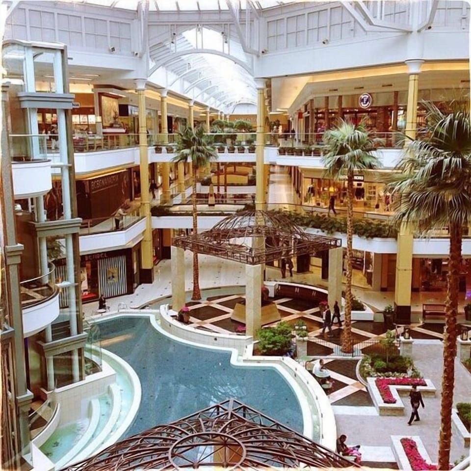 Soak up resort vibes beside a dramatic indoor pool atrium.
