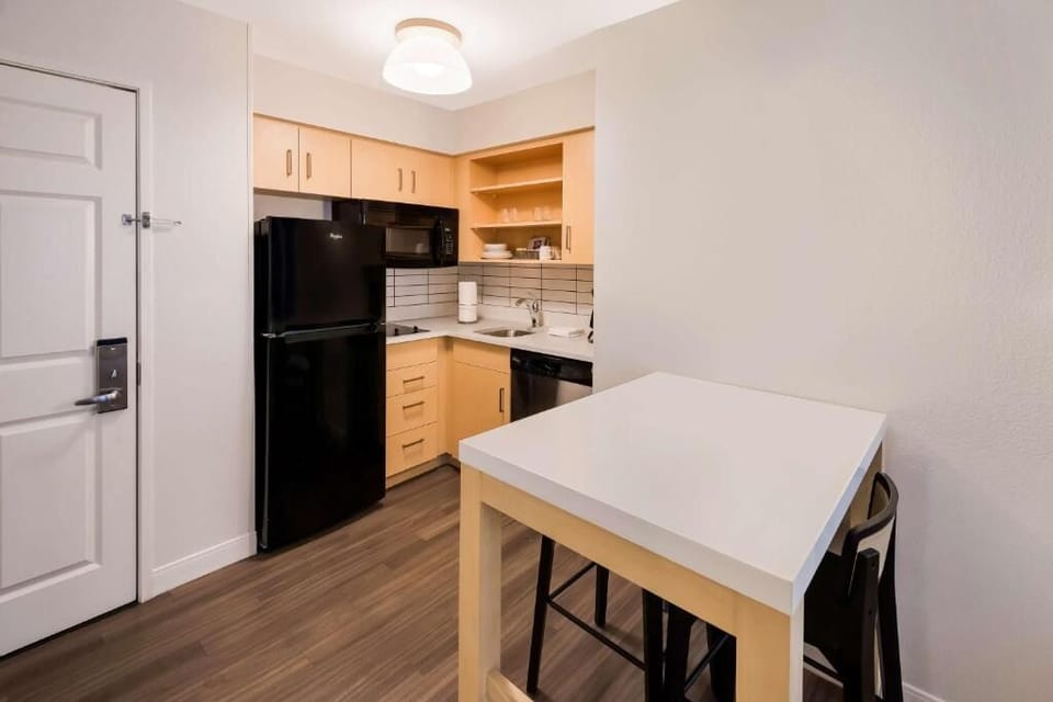 Cook simple meals easily with fridge, microwave, and clean counters.