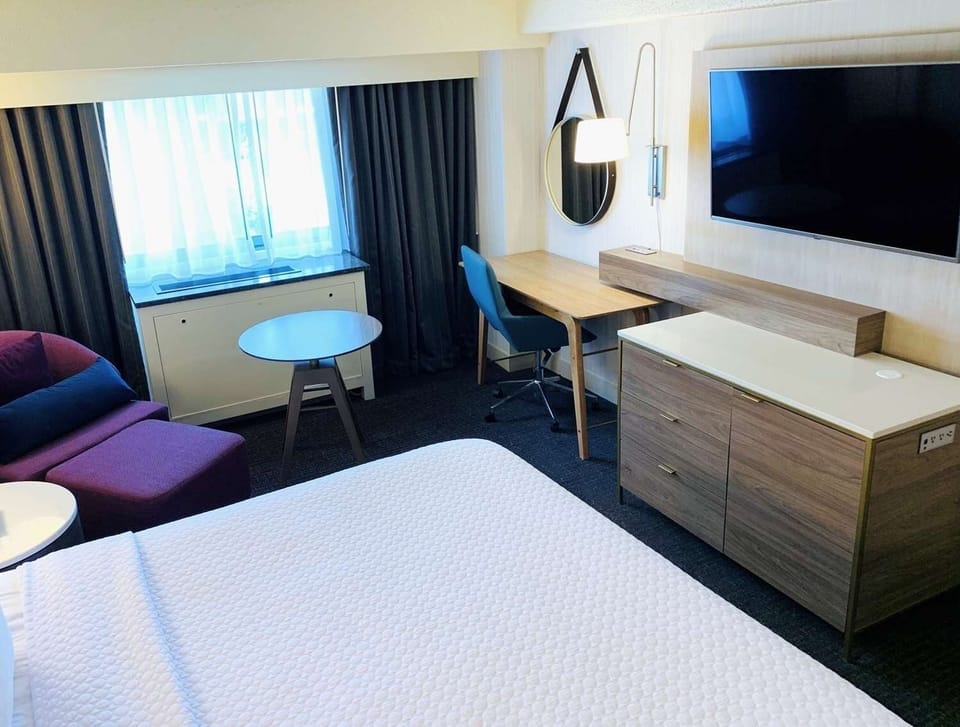 Settle in with a cozy lounge corner and handy workspace.