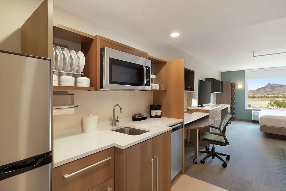 Prepare easy meals with fridge, sink, and handy microwave.