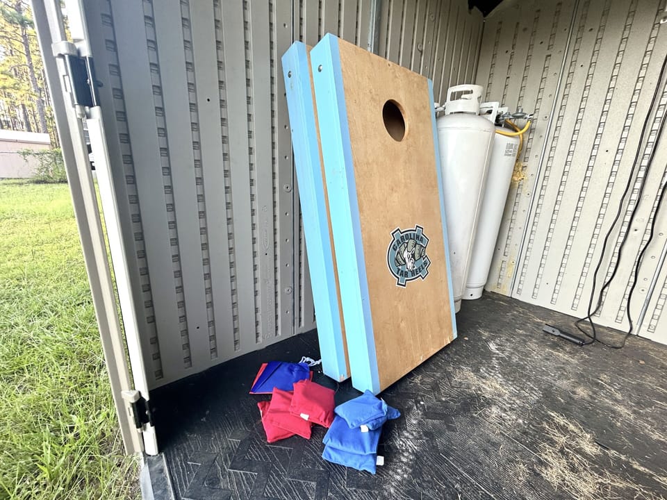 cornhole boards in the brown shed
