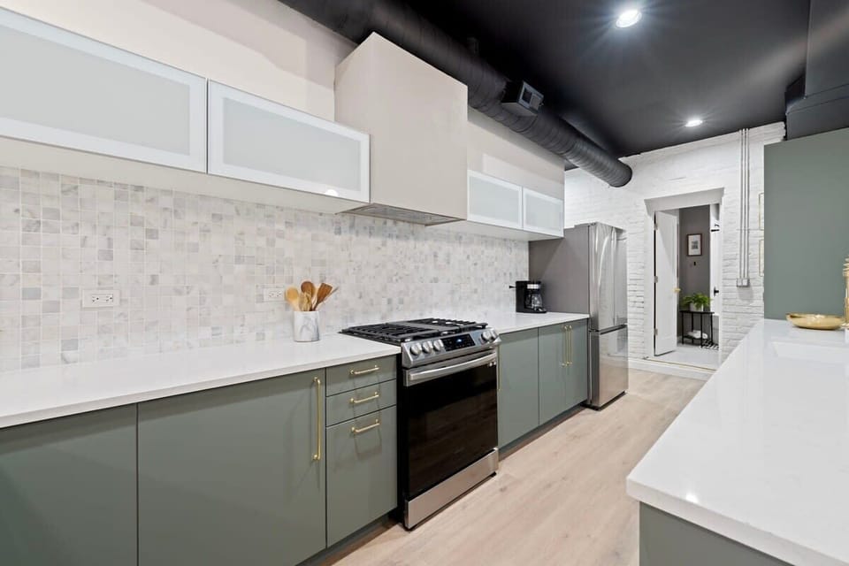 Streamlined kitchen view highlighting modern cabinetry & efficient layout.