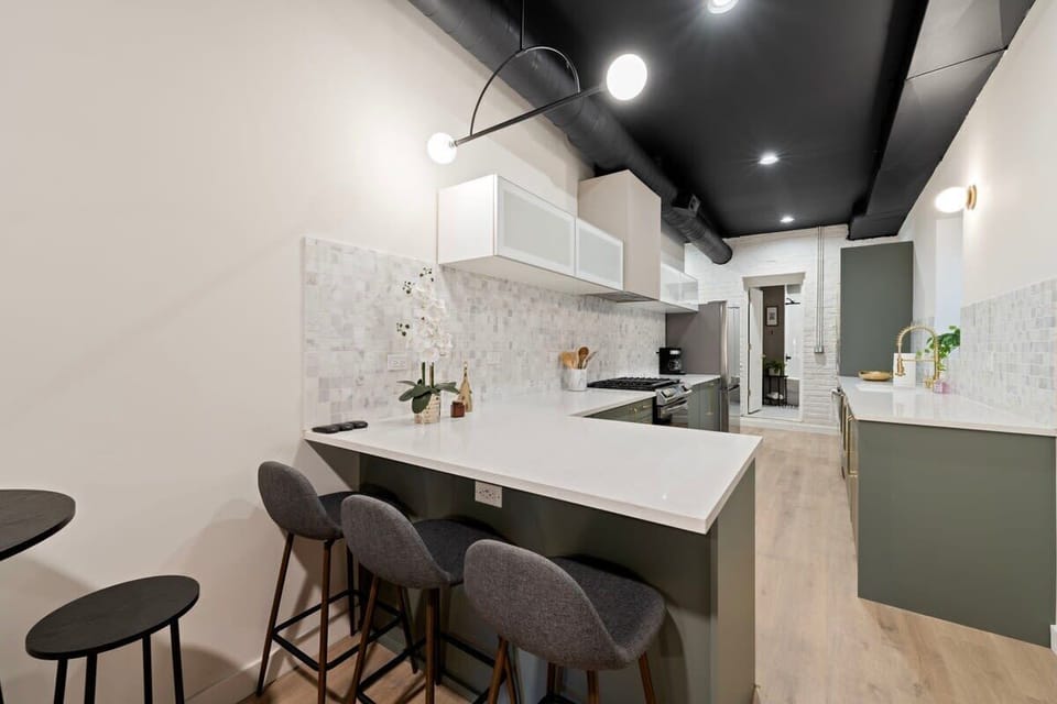 Sleek kitchen setup w/ clean counters & contemporary finishes for easy cooking.