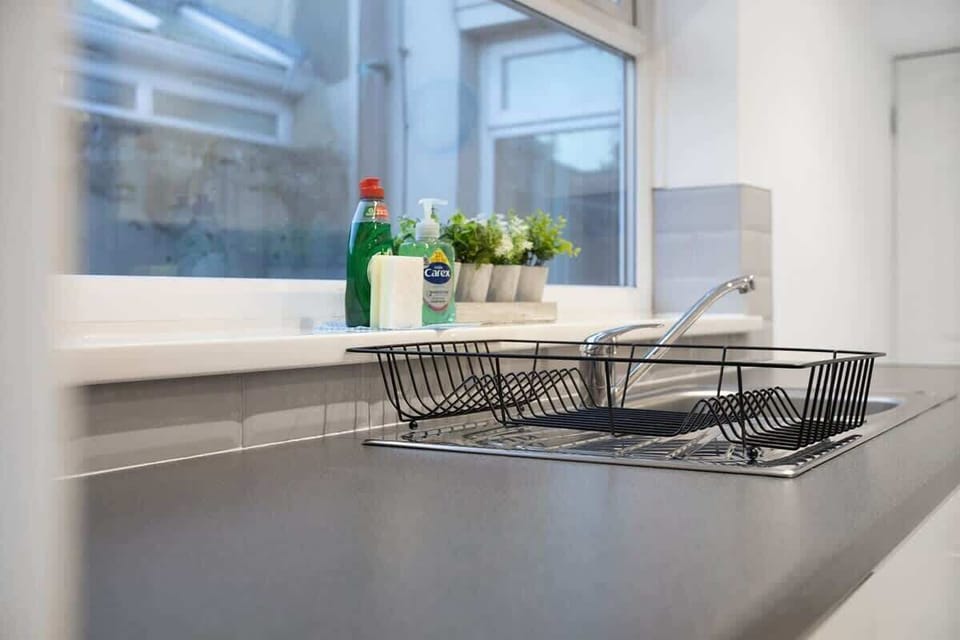 Family-friendly kitchen oasis equipped with all essentials, including a washer & dryer, oven, fridge and full cookware set. 