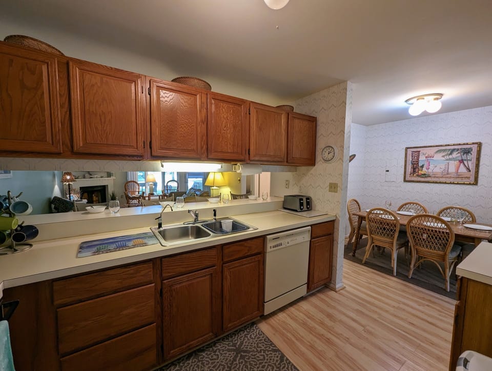 726 Bayberry Circle - Kitchen to Dining Perspective - Perspective view showing the kitchen's workspace and its proximity to the adjacent dining area, highlighting the practical and open layout.