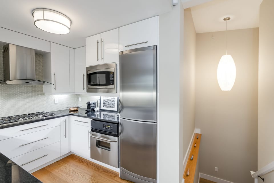 View of kitchen and stairs to lower level