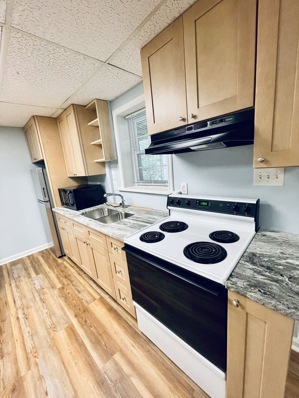 All essentials included! Stove, microwave, fridge, coffee pot, & dishes. 