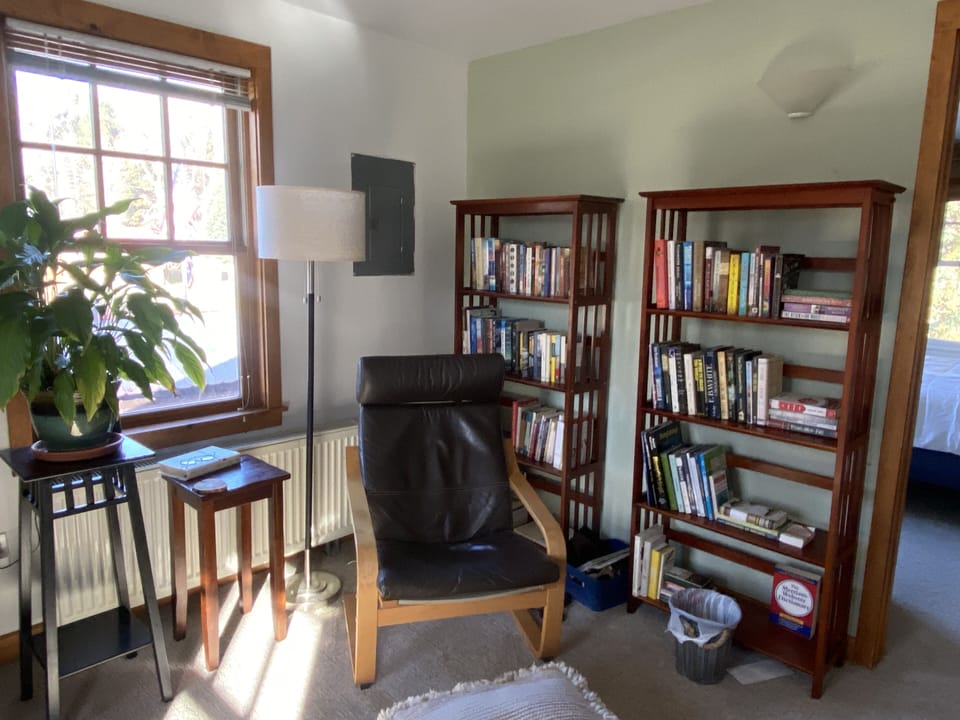 Sitting area at top of stairs, outside guestroom and bath