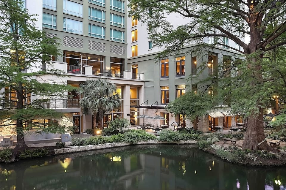 Take in the illuminated riverside facade as evening settles in.