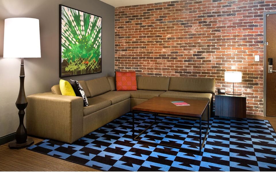 Kick back in a stylish lounge with bold art and texture.