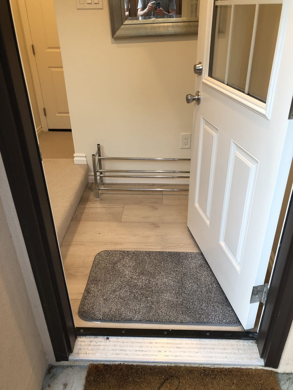 Guesthouse entrance. Secured door to main house visible in the background.