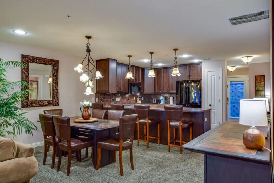 View into dining room and kitchen from family room (laundry room just off the front door).
