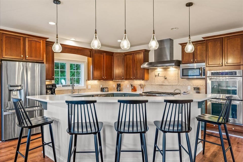Seating at the island and an open layout are perfect for entertaining and enjoying quality time together during your vacation