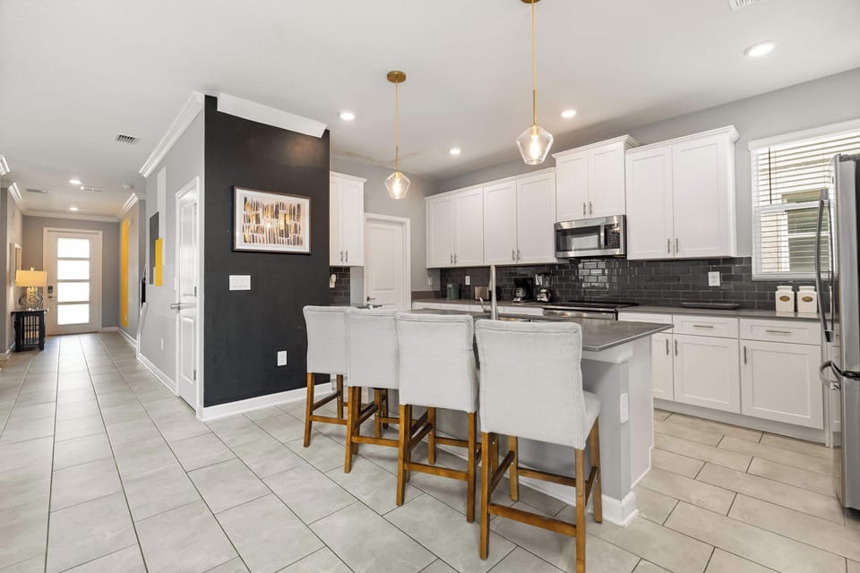 Kitchen island with bar seating — great for casual meals or conversations while cooking.