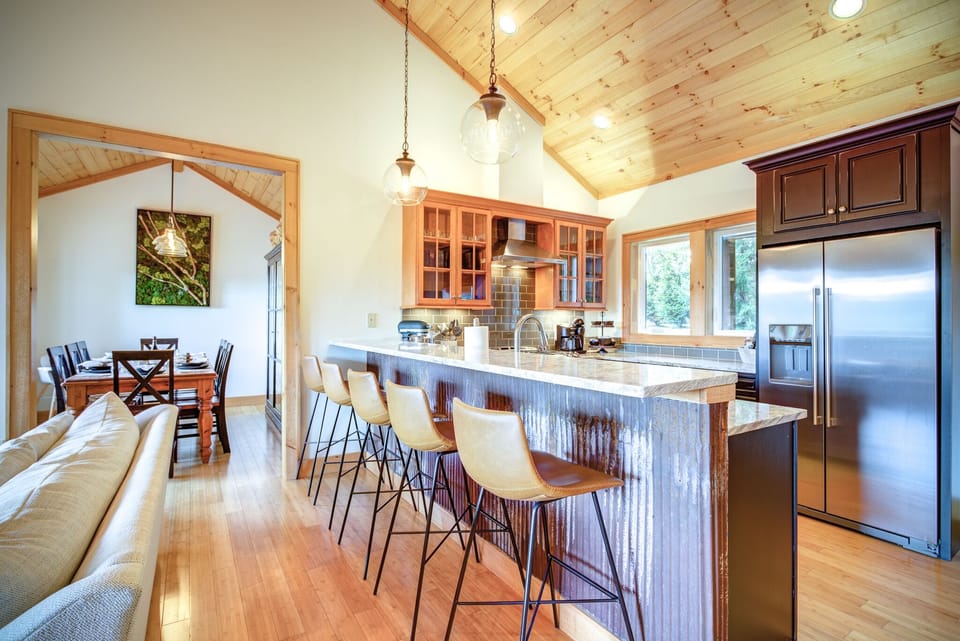 Kitchen island with 5 stools and attached dining room- great space for gathering