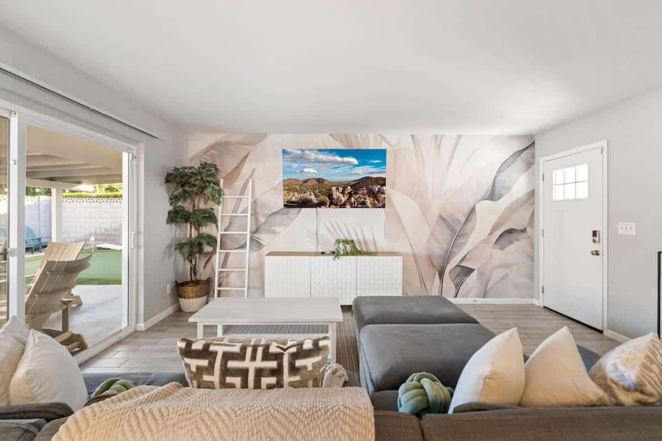Unwind in your spacious living room where soft textures and a soothing color palette create a peaceful retreat. Natural light pours in through glass doors that open to your private patio.