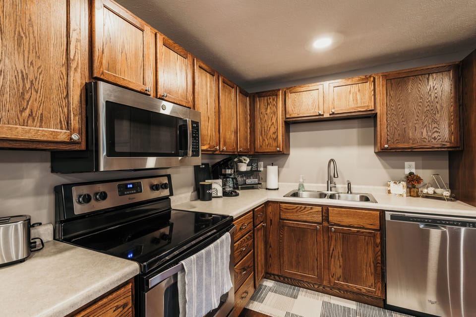 Updated & stocked with standard kitchen & cooking supplies. Seating for 6.