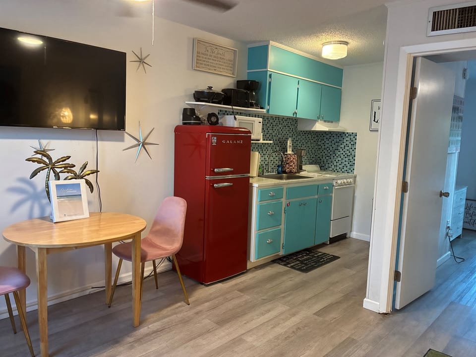 2 seat dining room and 60 inch tv.
