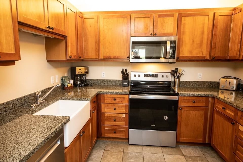 Full kitchen w/ dishwasher, stove, oven, microwave, full fridge, etc.