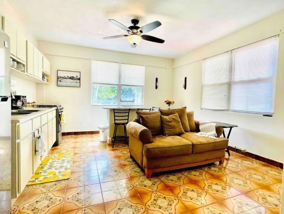 Unit B: open area with kitchen, TV, sitting and dining area.