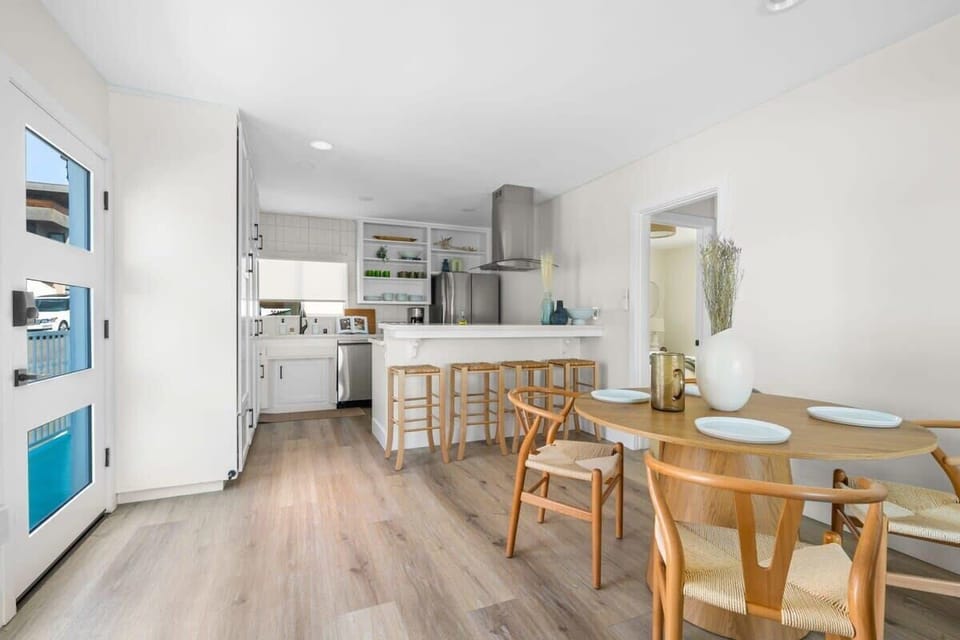 The dining table in this home is perfectly positioned for guests to take in the stunning ocean views while enjoying a meal