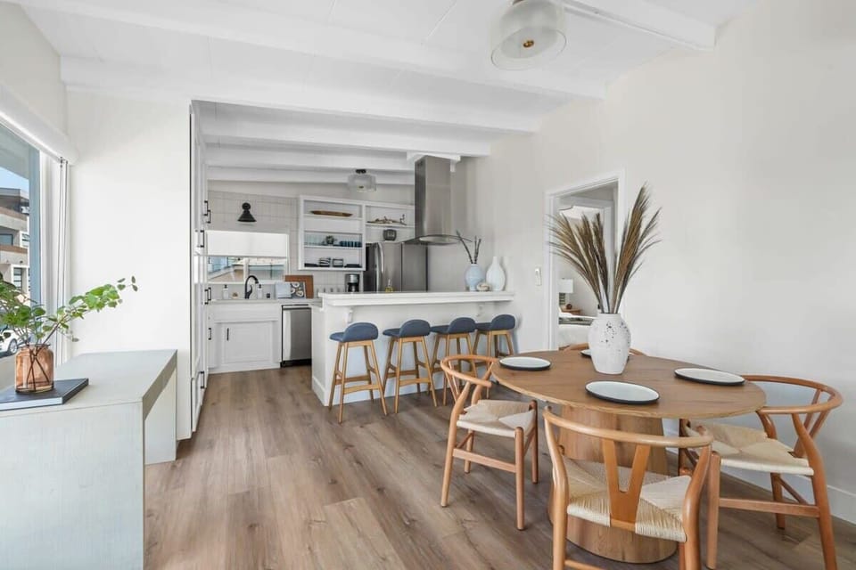 The dining table in this home is perfectly positioned for guests to take in the stunning ocean views while enjoying a meal.