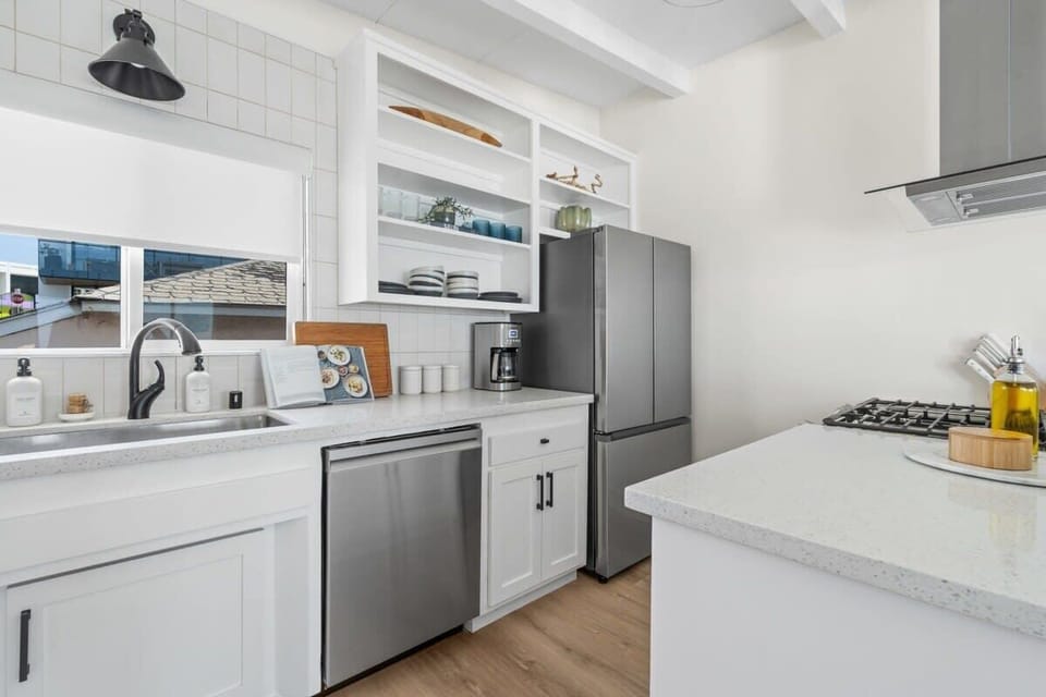 This home's beautiful kitchen is fully equipped with everything needed to cook a delicious meal for friends and family.