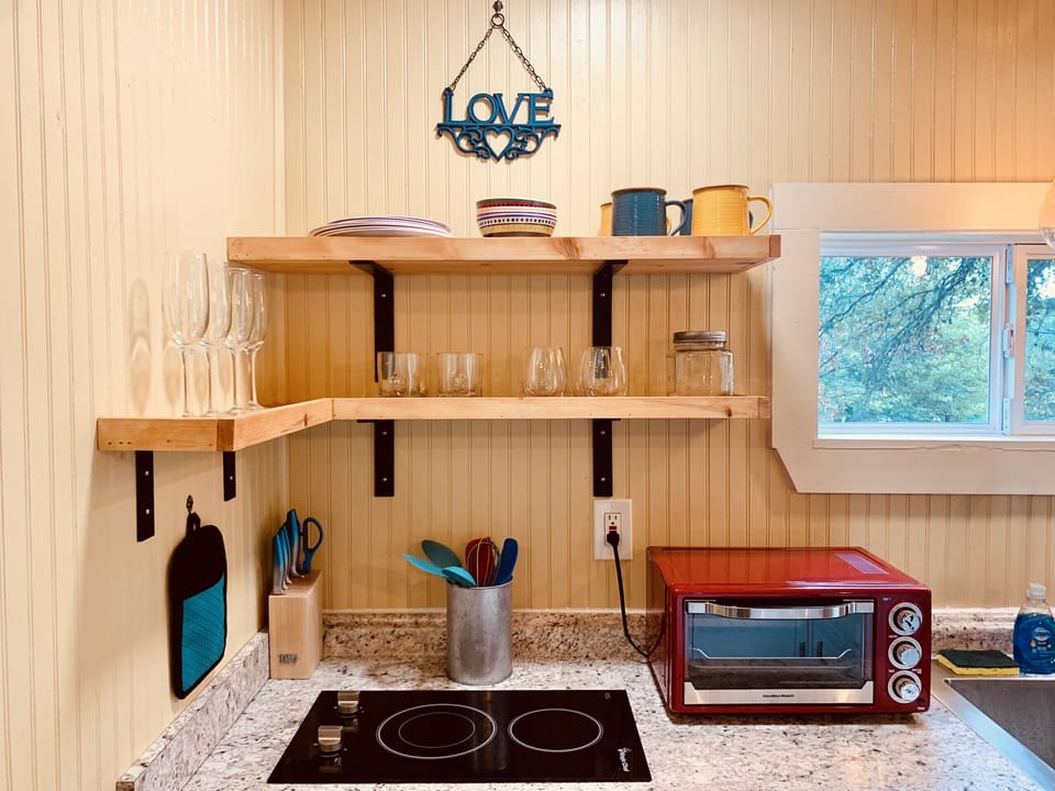 Kitchenette with all necessities for cooking basic meals.