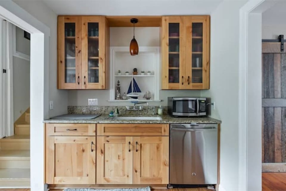 Fully equipped kitchen with view of backyard and pool