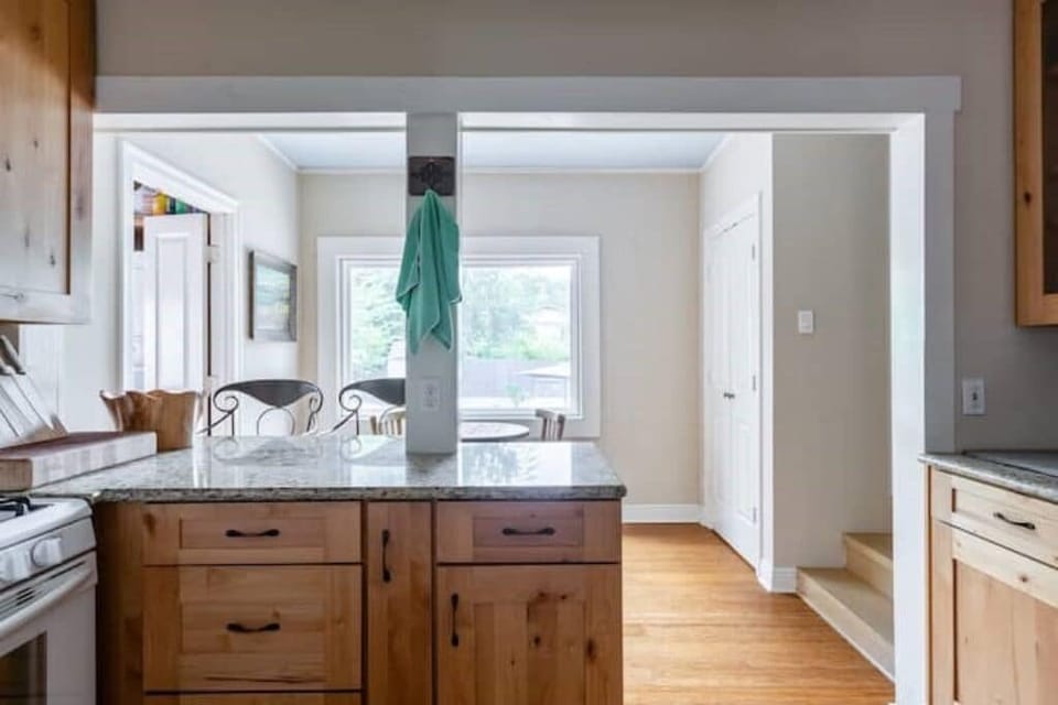 Fully equipped kitchen with view of backyard and pool
