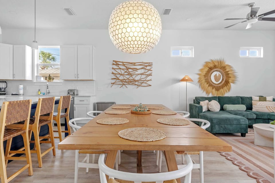 Bar seating and a large dining table—because great food brings people together. - The Pinkshell - Panama City, FL