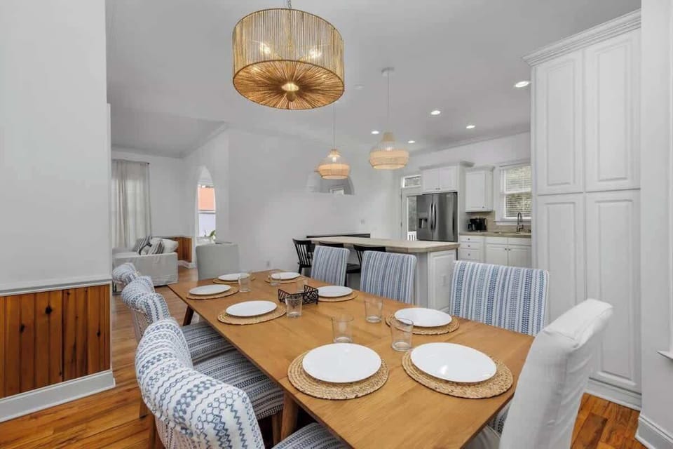 Enjoy meals together at the dining room table, the perfect place for family dinners, game nights, and conversation. - The Tiara - Murrells Inlet, SC