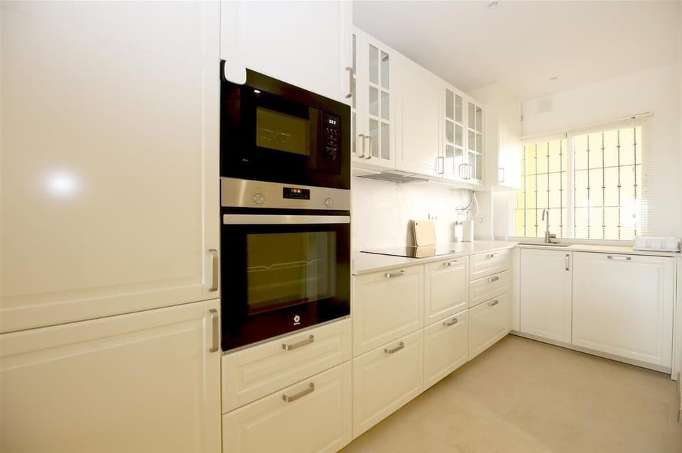 Modern open kitchen is very well equipped with quality appliances