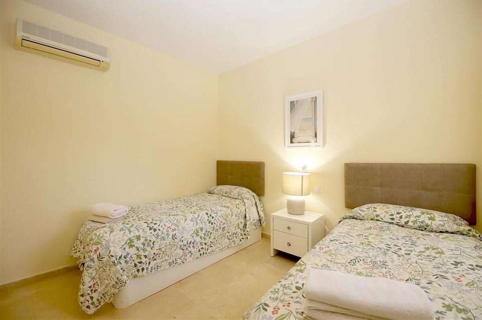 Another picture of the twin bedroom with air conditioning