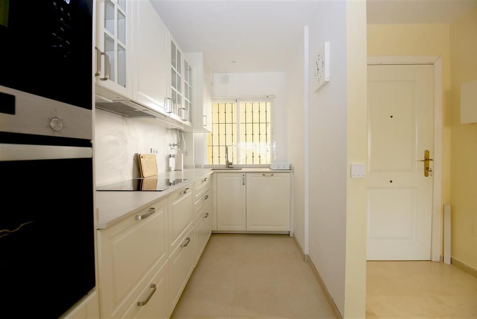 Modern kitchen is fully open to the lounge and dining area