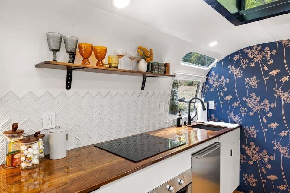 Gorgeous design inside. with walnut butcher block counter top and a full kitchen. 