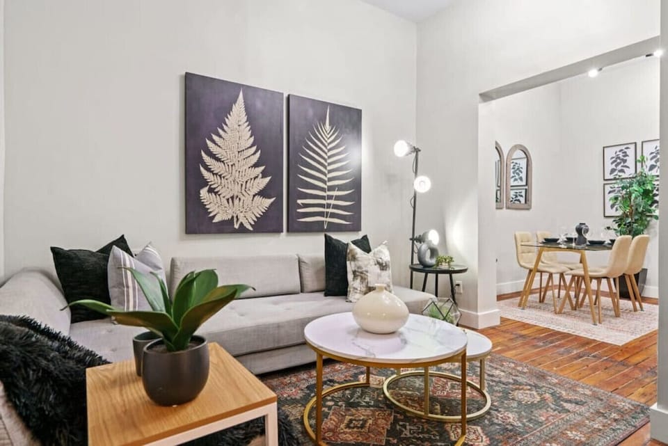 The spacious and cozy living space is furnished with a comfortable sofa.