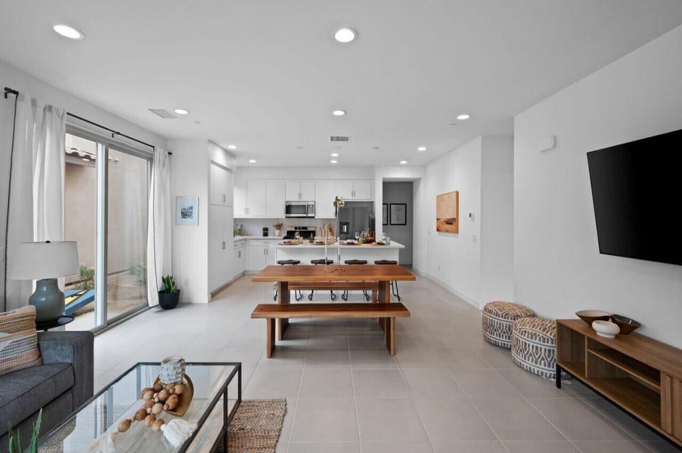 Spacious open-concept layout w/ long dining table & seamless flow throughout
