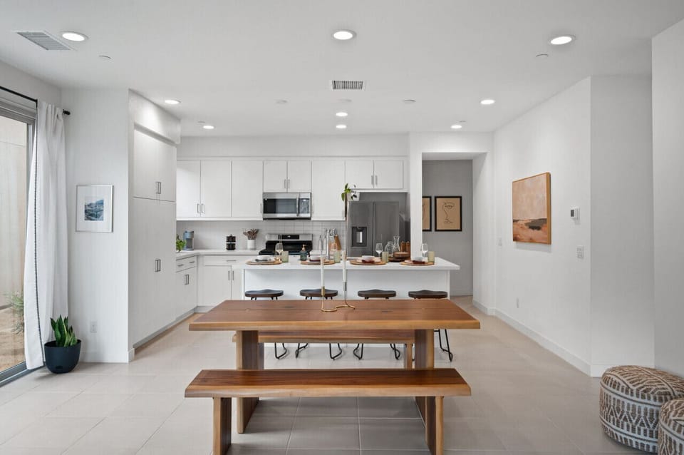 Airy kitchen & dining space w/ ample seating for shared meals together