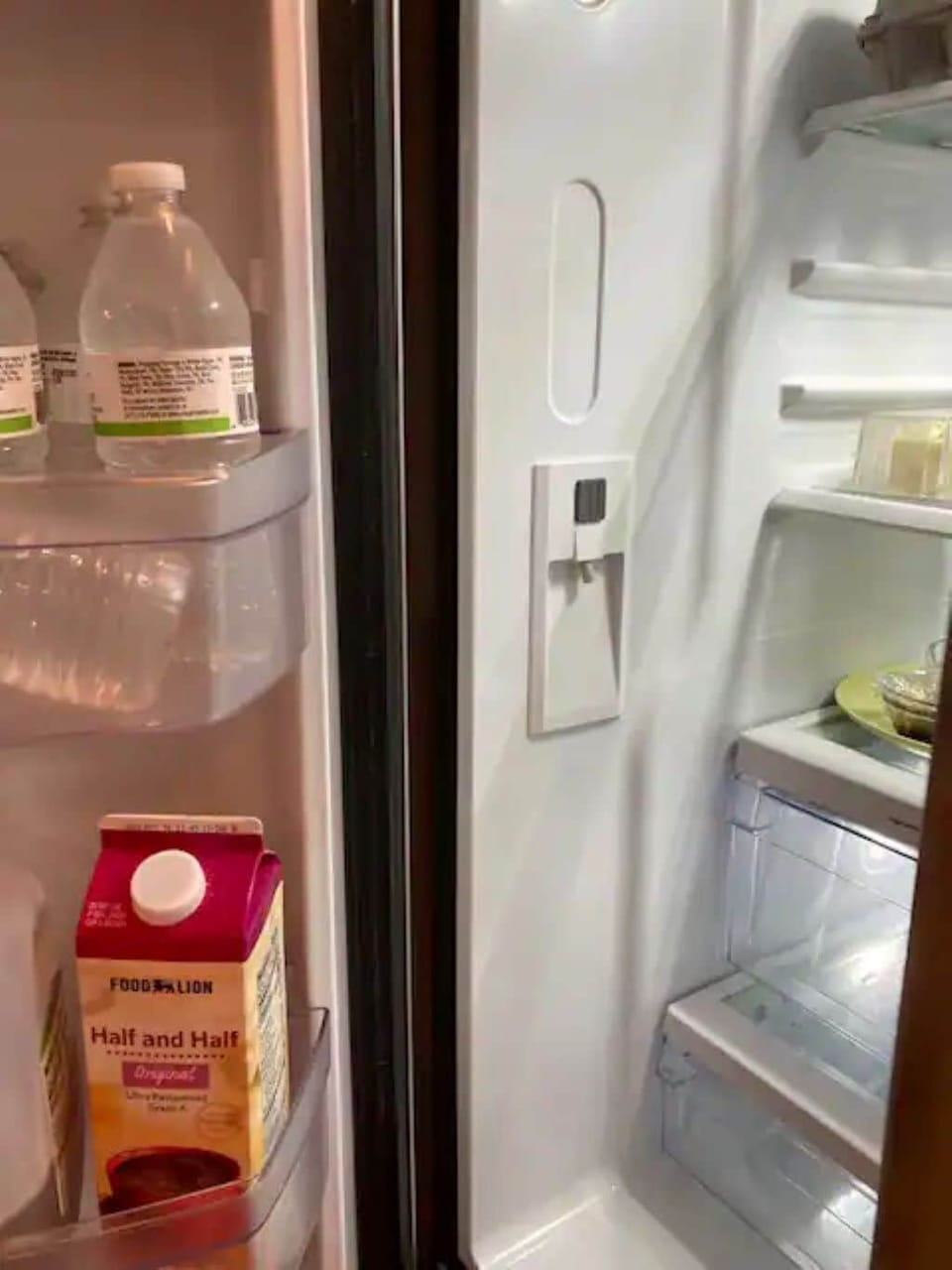 Filtered water dispenser on inside, left of fridge.