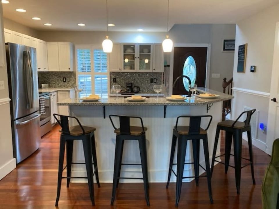 Swivel bar stools with open concept kitchen.