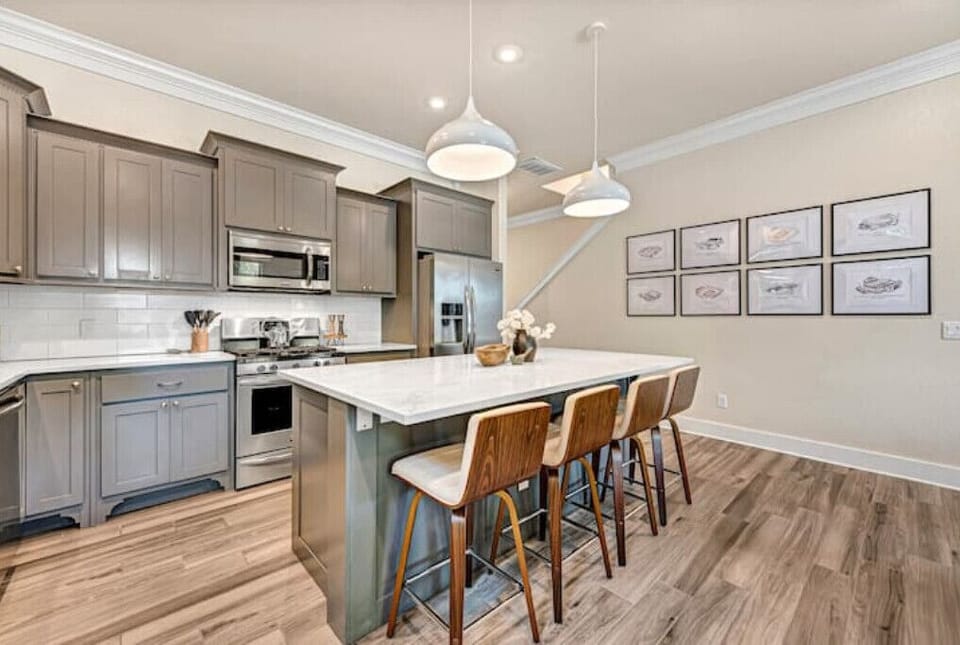 Island seating swivel chairs keep you connected to the kitchen & living spaces.