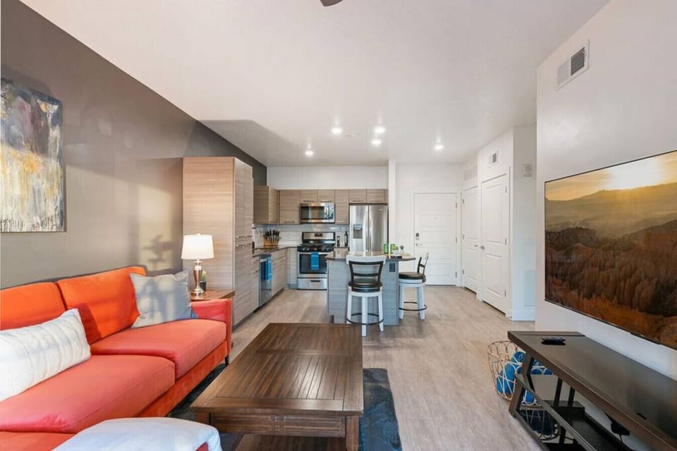 Gorgeous Livingroom, 65` TV, Comfy colorful couch. Beautiful views off your patio.