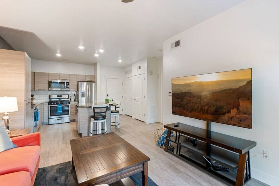 Gorgeous Livingroom, 65` TV, Comfy colorful couch. Beautiful views off your patio.