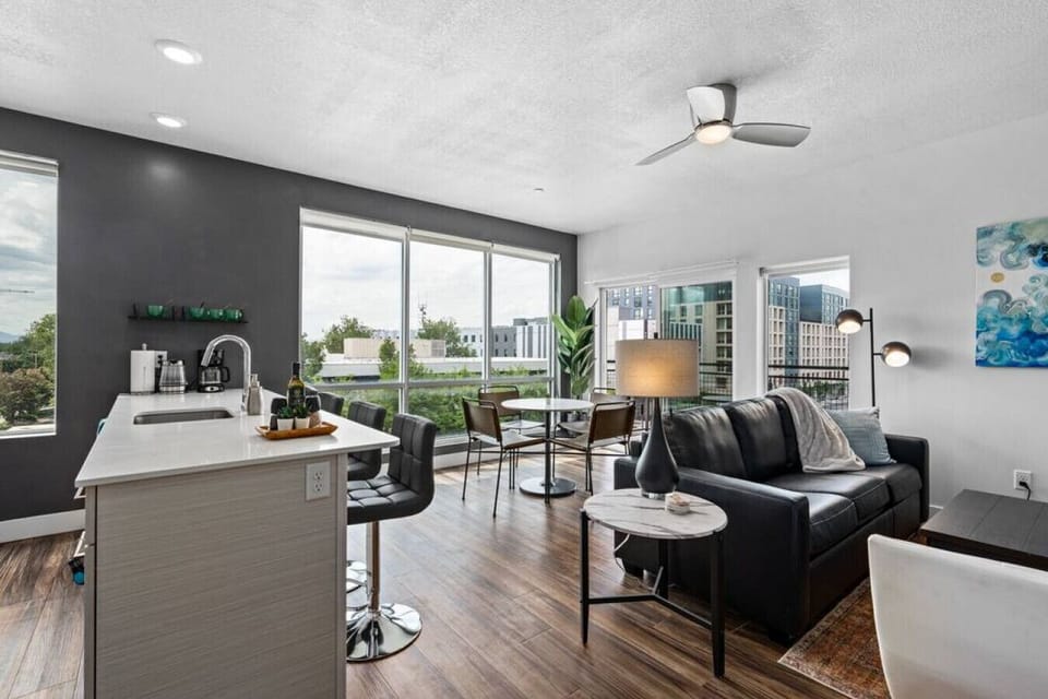 Open plan kitchen/living room with ceiling to floor windows and  amazing views
